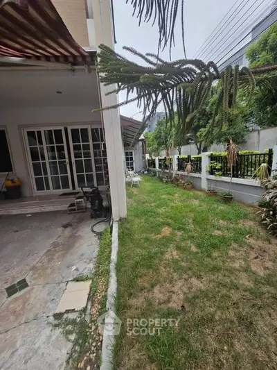 Charming garden view of a suburban home with lush greenery and spacious outdoor area.