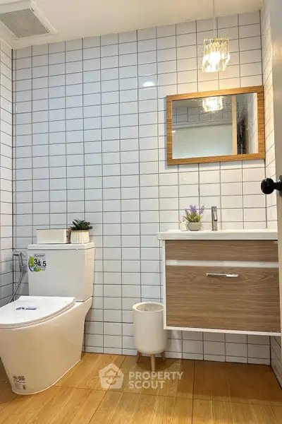 Modern bathroom with stylish vanity and elegant lighting