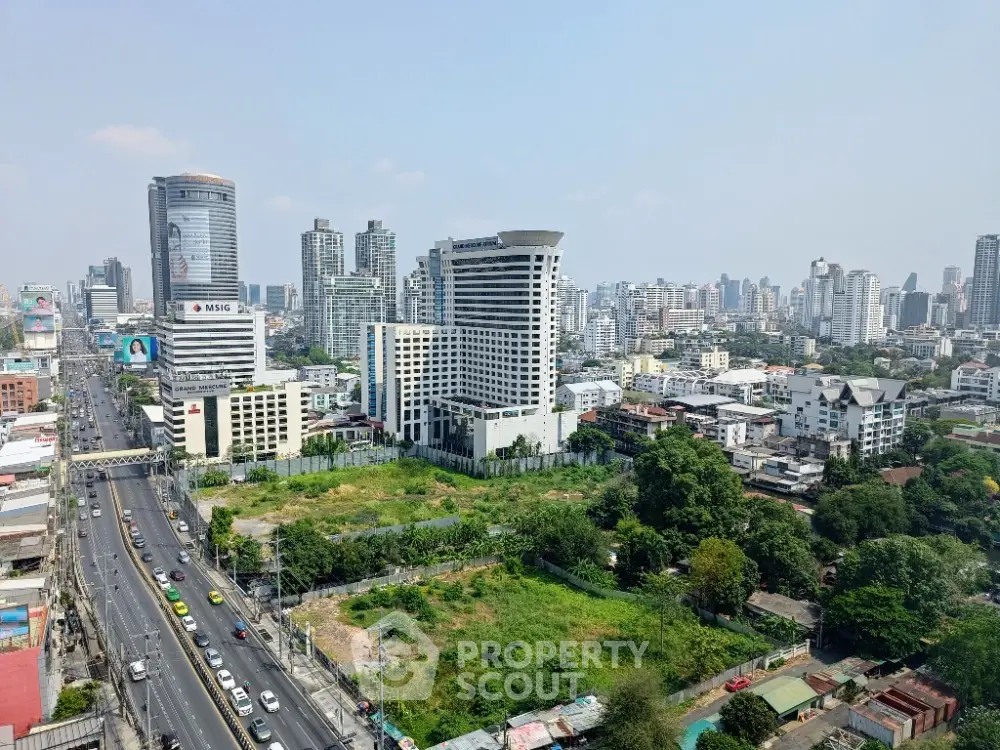 Stunning cityscape view showcasing modern high-rise buildings and lush greenery in a vibrant urban setting.