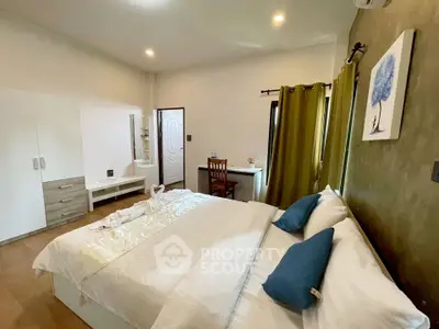 Spacious bedroom with modern decor, featuring a cozy bed, stylish wardrobe, and elegant lighting.