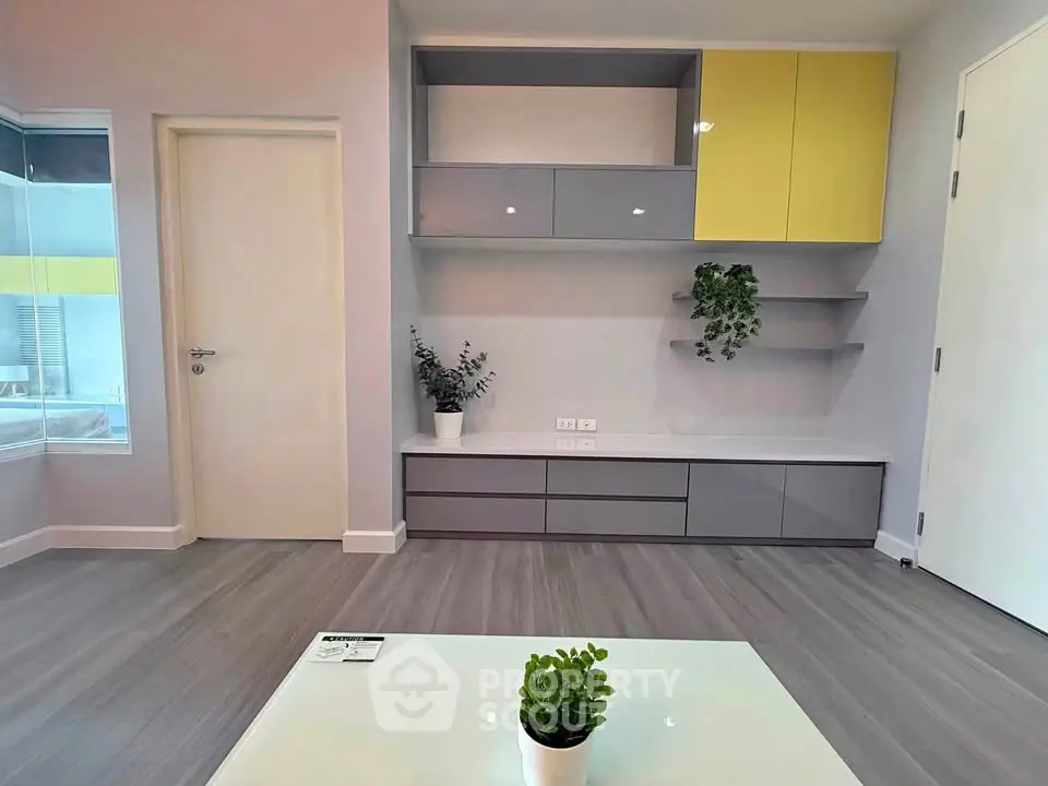 Modern living room with sleek built-in storage and stylish decor