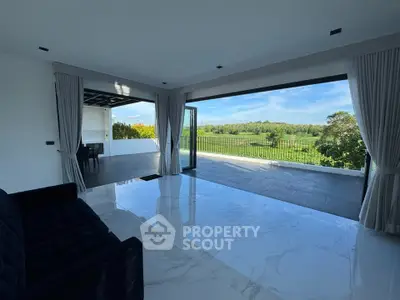 Luxurious living room with open layout and stunning garden view