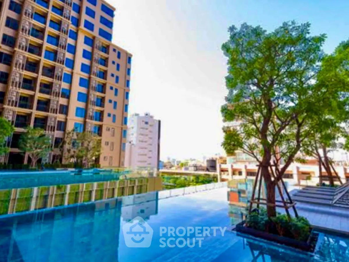 Luxurious urban apartment with stunning poolside view and modern architecture.