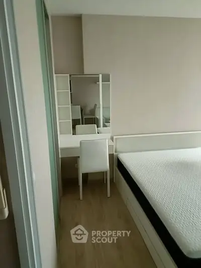 Modern minimalist bedroom with sleek furniture and natural light