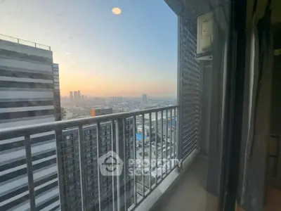 Stunning high-rise balcony view with cityscape at sunset, perfect for urban living enthusiasts.