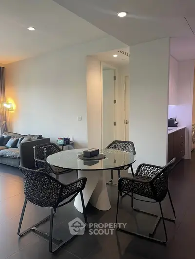 Modern living room with stylish dining area and cozy seating, perfect for urban living.