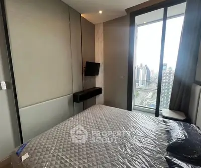 Modern bedroom with city view and sleek design in high-rise apartment
