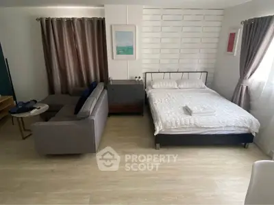 Cozy studio apartment with modern decor and natural light