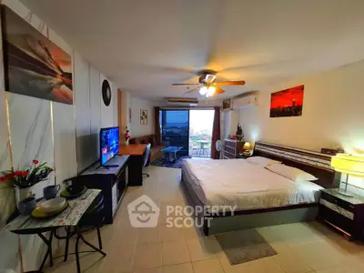 Spacious studio apartment with modern decor and city view, featuring a cozy bed and stylish living area.