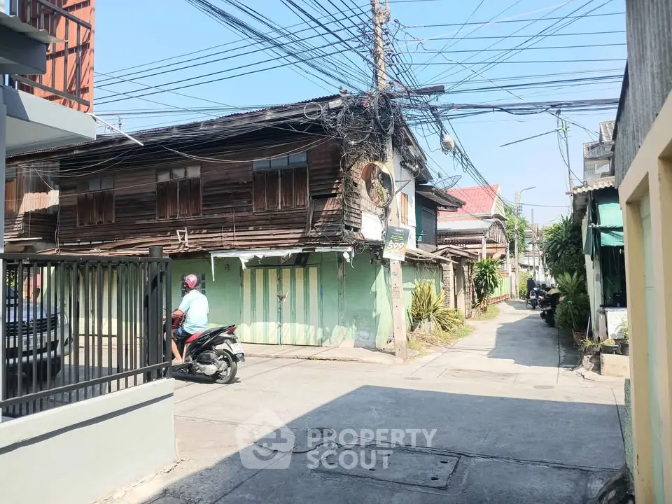 Charming rustic neighborhood street with vintage wooden houses and urban vibe.