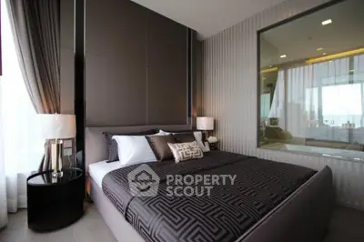 Luxurious modern bedroom with elegant decor and large window view