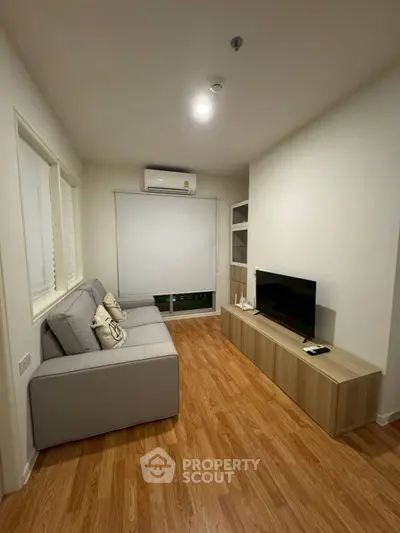 Cozy living room with modern decor and wooden flooring