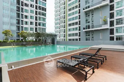 Luxurious apartment complex with a stunning outdoor pool and modern design.