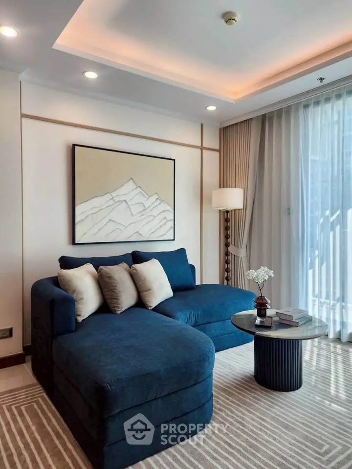 Luxurious living room with modern blue sofa and elegant decor