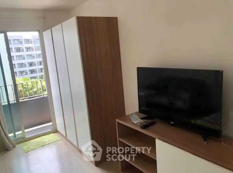 Modern living room with balcony view and sleek furniture design