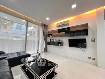 Modern living room with sleek furniture and ambient lighting