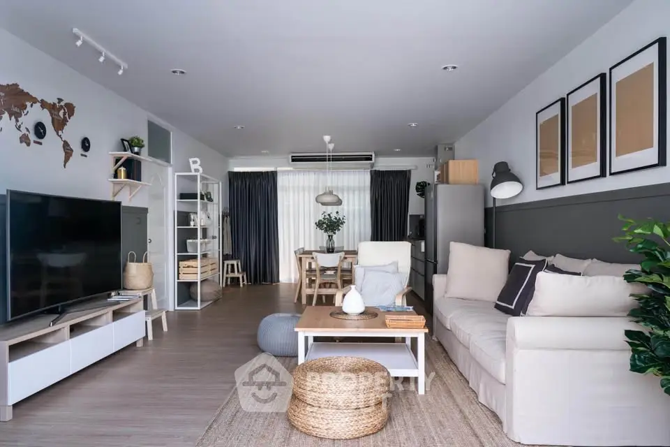 Spacious modern living room with stylish decor and natural light