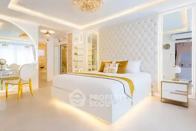 Luxurious bedroom with elegant decor and ambient lighting, featuring a plush bed and stylish furnishings.