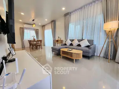 Spacious modern living room with elegant decor and natural light