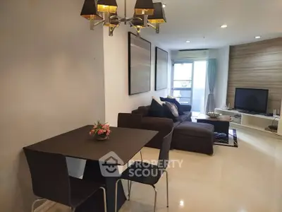 Modern living room with stylish dining area and cozy seating, perfect for relaxation and entertainment.