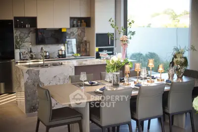 Luxurious modern kitchen with elegant dining area and marble island