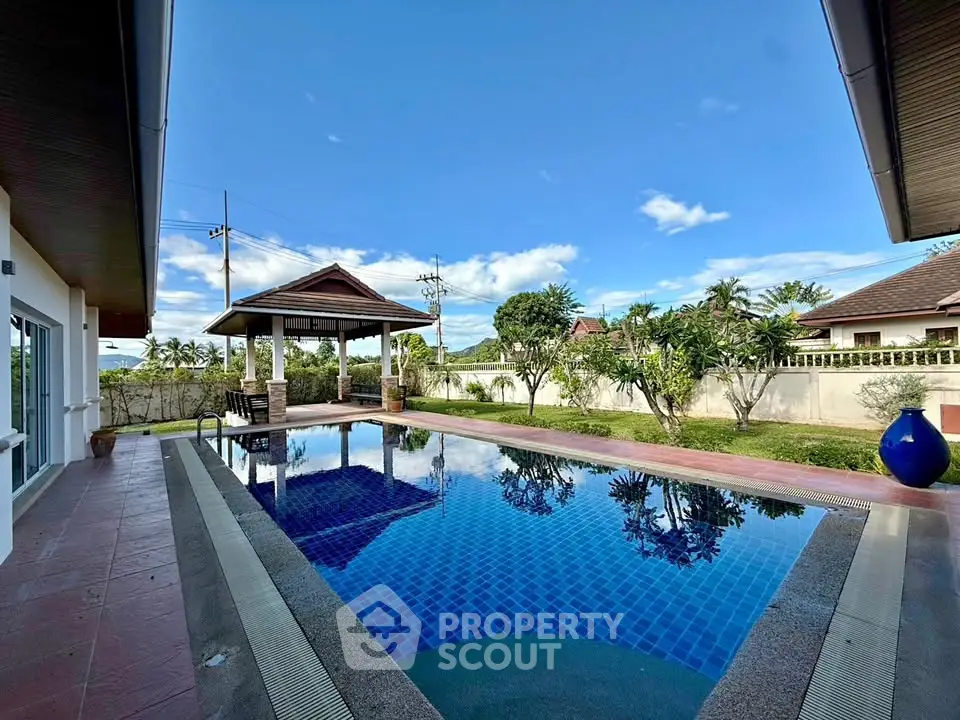 Luxurious villa with private pool and lush garden in serene setting