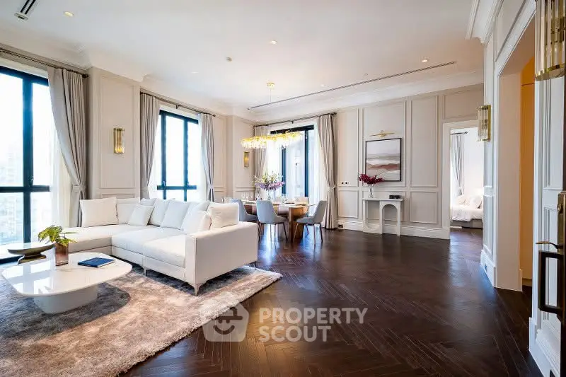 Luxurious living room with elegant decor and spacious layout, featuring hardwood floors and abundant natural light.