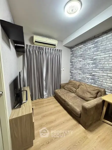 Cozy living room with modern decor and air conditioning