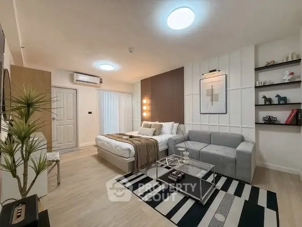 Modern living room with stylish decor, cozy seating, and ambient lighting in a contemporary apartment.