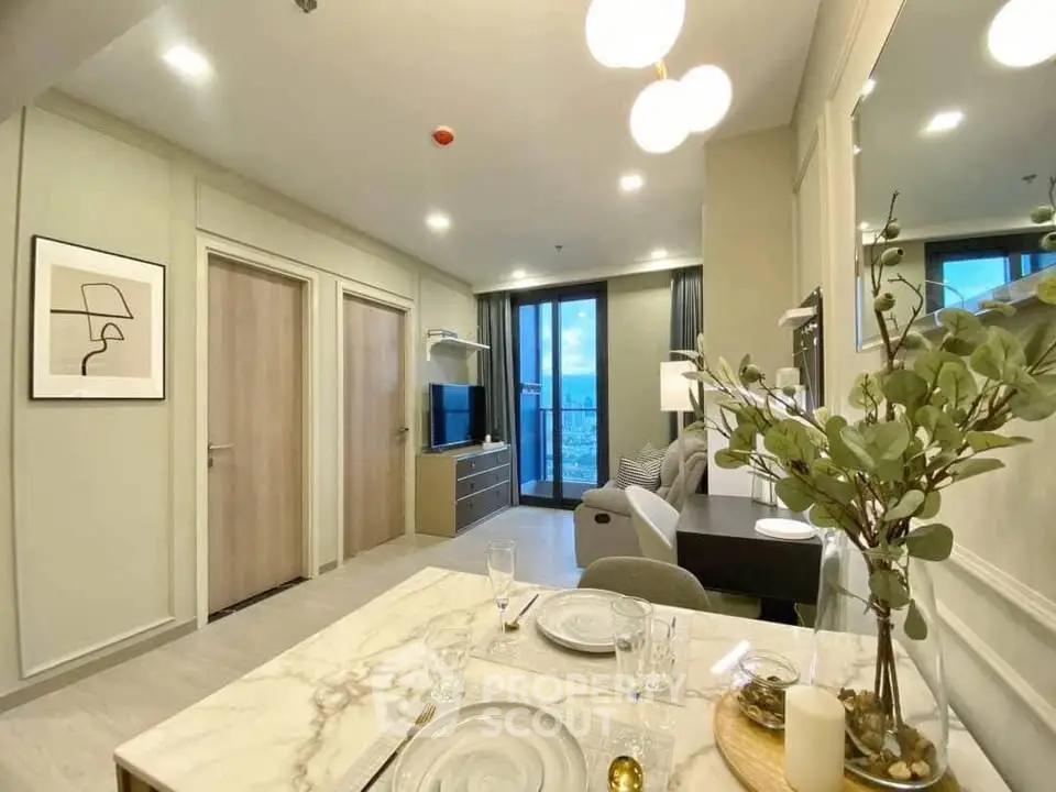 Modern open-plan living and dining area with stylish decor and large windows offering a stunning view.