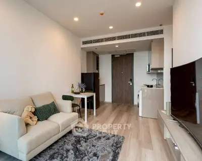 Modern living room with cozy sofa and stylish decor in open layout apartment.