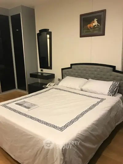 Cozy bedroom with elegant decor and modern furnishings in a stylish apartment.