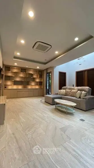Spacious modern living room with elegant lighting and stylish furniture