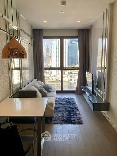 Modern living room with city view, stylish decor, and natural light