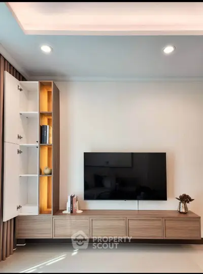 Modern living room with sleek TV unit and stylish decor