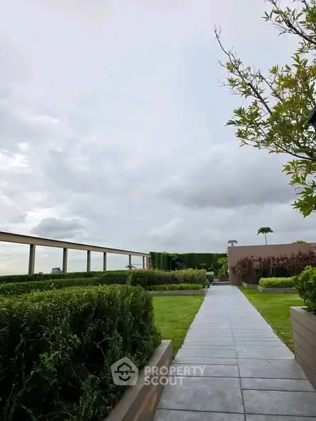 Luxurious rooftop garden with lush greenery and modern design, perfect for relaxation and leisure.