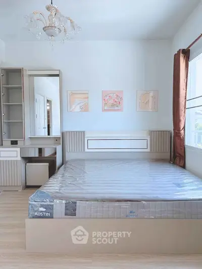 Modern bedroom with elegant chandelier and stylish decor