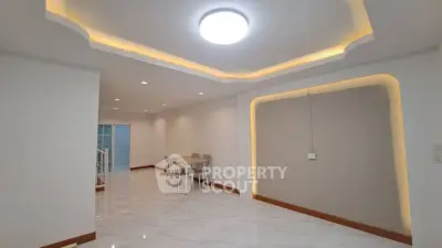 Spacious modern interior with elegant ceiling lights and marble flooring