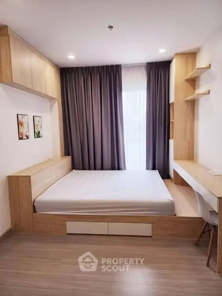Modern bedroom with built-in wooden furniture and natural light