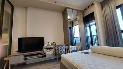 Modern bedroom with large windows and stylish furniture in a high-rise apartment.