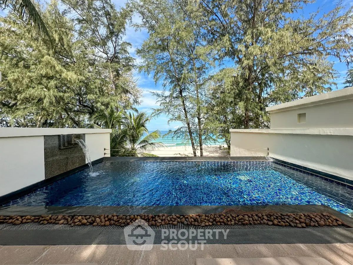 Luxurious private pool with ocean view surrounded by lush greenery