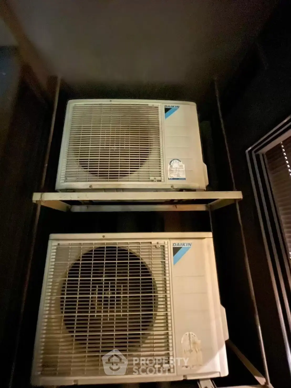 Dual air conditioning units installed in a residential building, showcasing efficient climate control solutions.