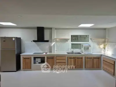 Modern kitchen with sleek cabinetry and stainless steel appliances, perfect for culinary enthusiasts.