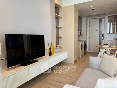 Modern living room with open kitchen and stylish decor