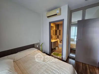Cozy bedroom with ensuite bathroom and modern air conditioning unit