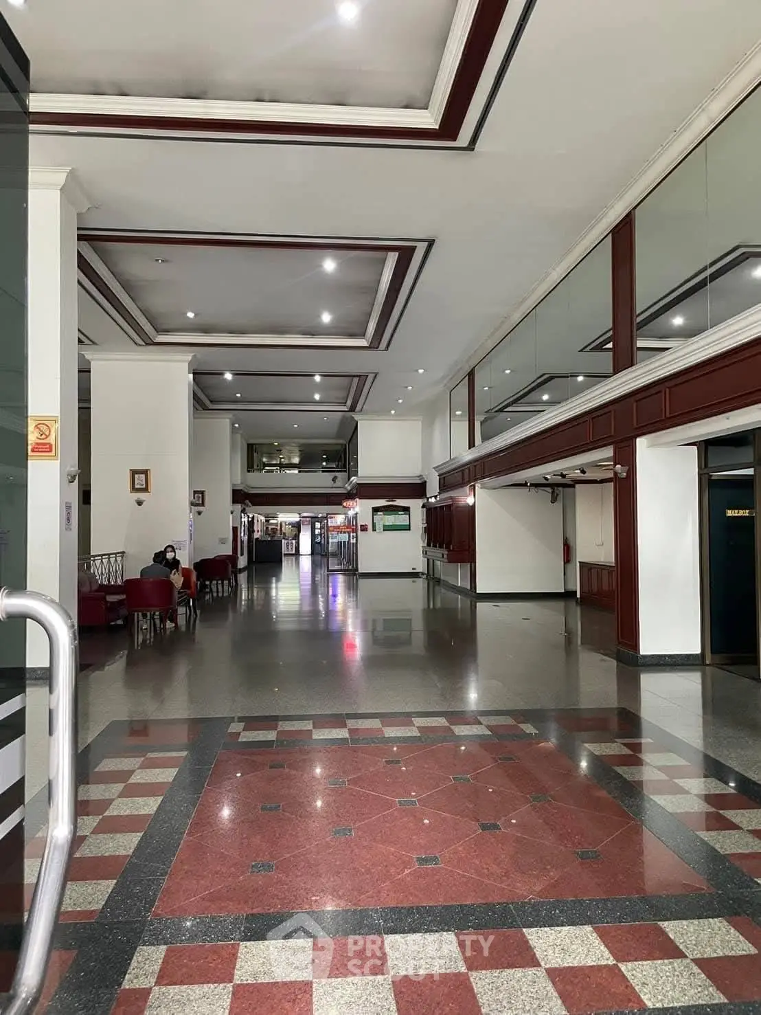 Spacious building lobby with elegant flooring and modern design.