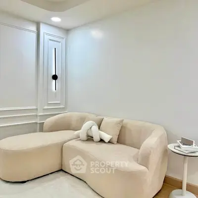 Elegant minimalist living room with modern beige sofa and stylish decor