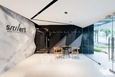 Modern office entrance with sleek design and glass doors