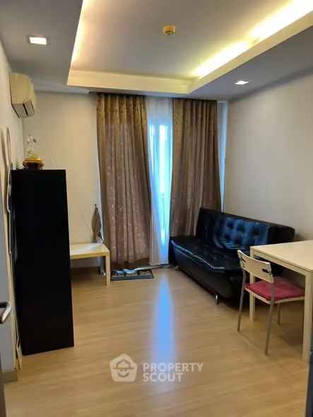 Cozy living room with modern furniture and elegant curtains