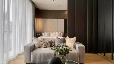 Luxurious modern living room with elegant decor and large windows